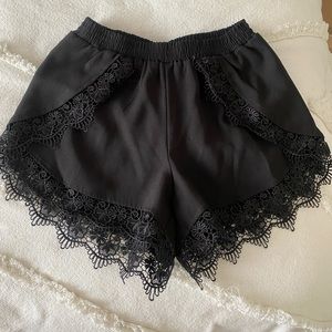 Mika & Gala black floral shorts size 8